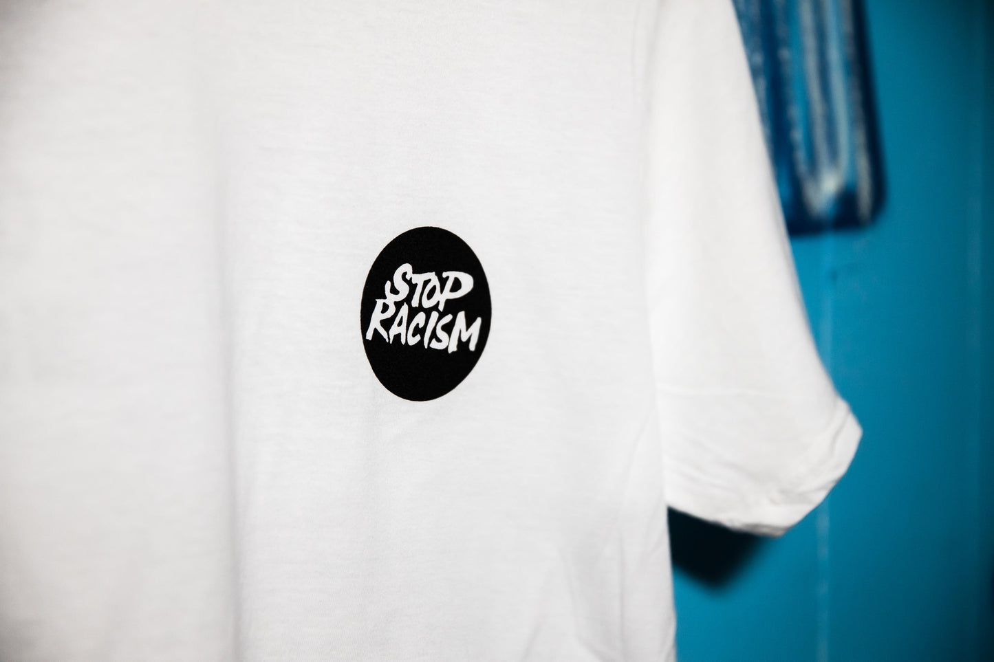 Stop Racism t-shirt (White) designed by Paul Camo